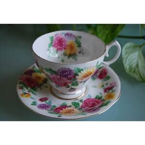 Queen Anne bone china “Autumn Glory” Floral footed teacup & saucer, 1980s